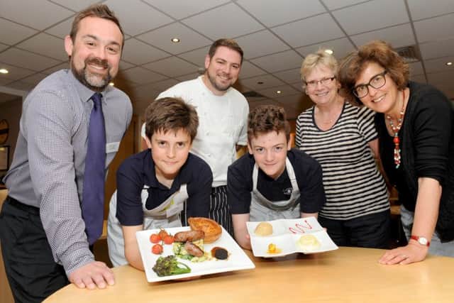 Winners Ryan Bloxsom, 13, and Scott Newell, 13, from Bay House School in Gosport with the judges, from left, business manager at the Wickham Co-operative Stuart Heaton, chef at The Marwell Hotel Phil Yeoman, home economist Davina Tibbetts, and organiser of The Create & Cook competition Min Raisman
Picture: Sarah Standing (160669-7440)