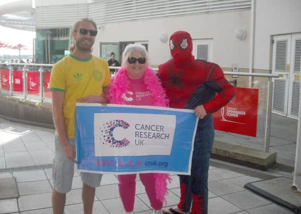 From left: Andrew Hayward, 34, Jeannette Hayward, 59, Chris Hayward, 37, who abseiled down the Spinnaker Tower