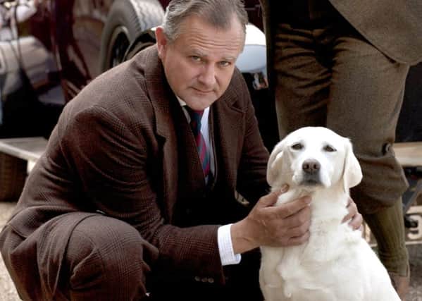 Hugh Bonnevlle as Robert Grantham with Isis the dog in Downton Abbey