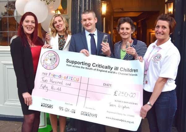 Assistant manager Kelly Kelly, Kasia May, manager Dave Brown, Portsmouth South MP Flick Drummond, and Robyn Sargeant, trustee at the Friends of PICU which was presented with a Â£250 cheque at the reopening of The Dolphin in Old Portsmouth
