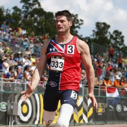 Dave Henson wins the gold medal in the T42 200m sprint