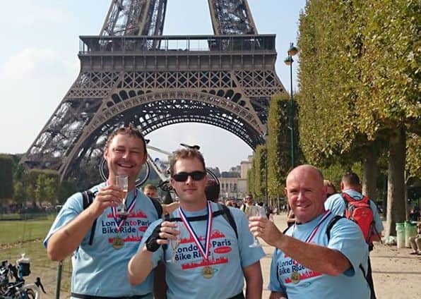 Novaseals managing director Gary Grundy and installations manager Ryan Jennings with Gosport Town Bikes owner Jason Lewry after the Wave105 Cash for Kids Paris cycle ride in 2014