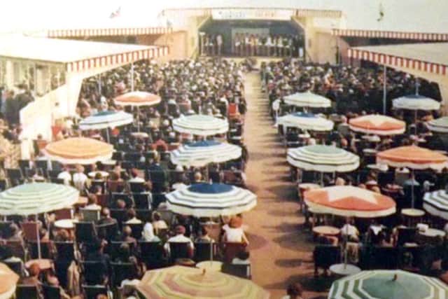 South Parade Pier's promenade deck with umbrellas in the 1960s