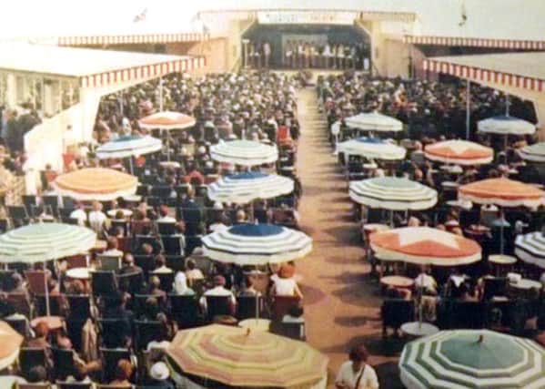 South Parade Pier's promenade deck with umbrellas in the 1960s