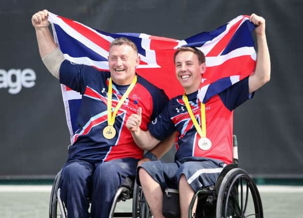 UK wheelchair doubles tennis champions Andy McErlean, left, and Alex Krol celebrate after winning gold at the Invictus Games Picture: Chris Jackson/PA Wire