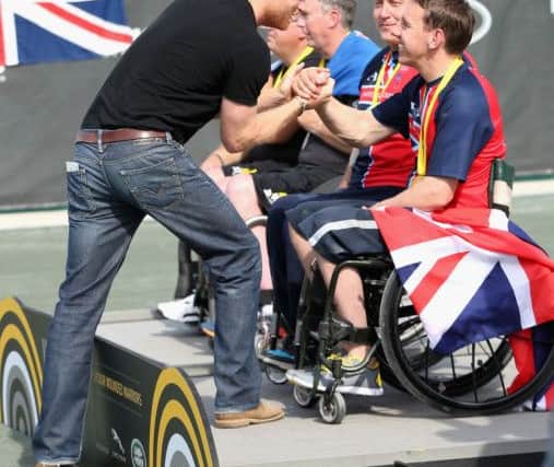 Prince Harry presents gold medals Andy McErlean and Alex Krol Picture: Chris Jackson/PA Wire