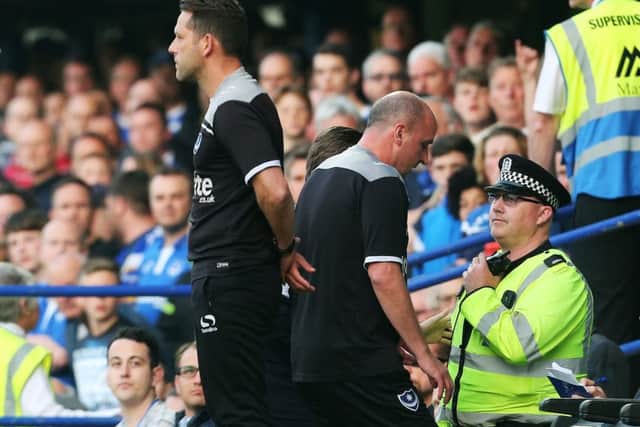 Pompey boss Paul Cook, centre, is sent to the stands early on in Pompey's League Two play-off semi-final first leg 2-2 draw with Plymouth    Picture: Joe Pepler