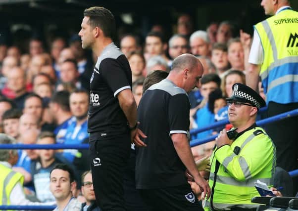 Pompey boss Paul Cook, centre, is sent to the stands early on in Pompey's League Two play-off semi-final first leg 2-2 draw with Plymouth    Picture: Joe Pepler
