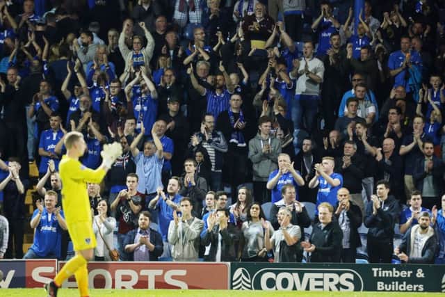 Pompey keeper Ryan Allsop applauds the Fratton faithful