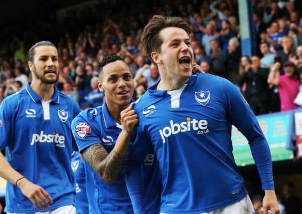 Kyle Bennett celebrates the opening goal with scorer Marc McNulty. Picture: Joe Pepler