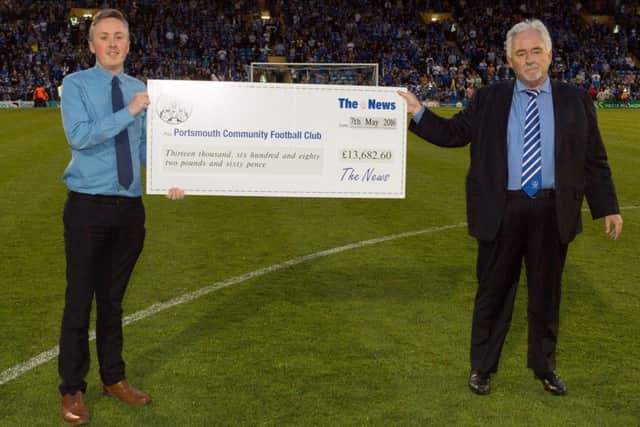 Iain McInnes, right, accepts a cheque from Howard Frost during half-time of the Pompey v Plymouth play-off game last night Picture: Simon Hill