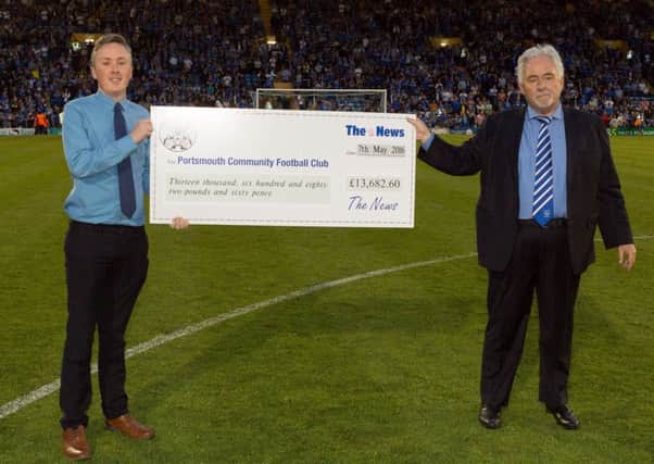 Iain McInnes, right, accepts a cheque from Howard Frost during half-time of the Pompey v Plymouth play-off game last night Picture: Simon Hill