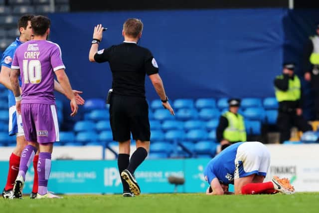 Michael Doyle holds his head in his hands after the incident with Jamille Matt Picture: Joe Pepler