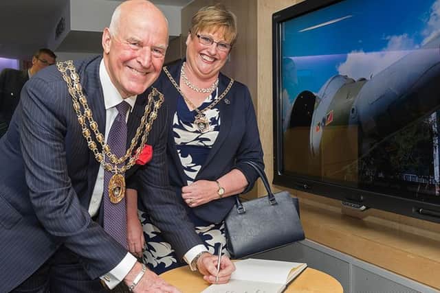 The outgoing mayor and mayoress of Fareham Cllr Mike Ford and his wife Anne signing the visitors' book Picture: Keith Woodland