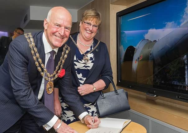 The outgoing mayor and mayoress of Fareham Cllr Mike Ford and his wife Anne signing the visitors' book Picture: Keith Woodland