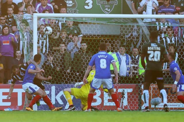 Peter Hartley steers the ball into the back of the Pompey net from a last-gasp corner to book Plymouths place in the League Two final at Wembley later this month Picture: Joe Pepler