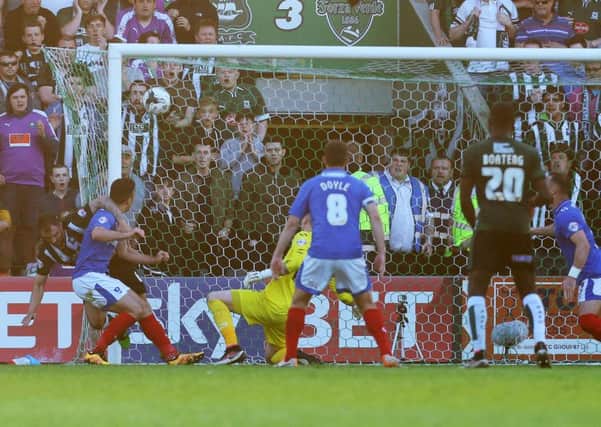 Peter Hartley steers the ball into the back of the Pompey net from a last-gasp corner to book Plymouths place in the League Two final at Wembley later this month Picture: Joe Pepler
