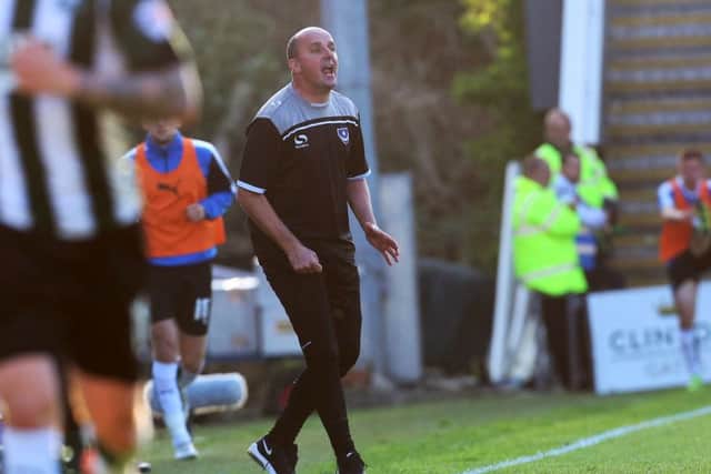 Iain McInnes insists the board still believe Paul Cook is the right man for the job. Picture: Joe Pepler