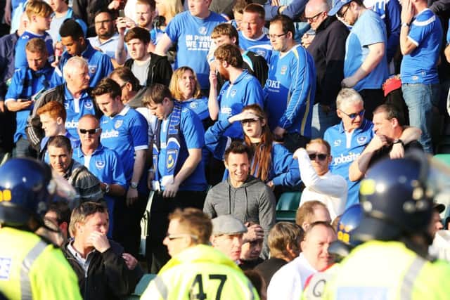 Dejected Pompey fans after defeat to Plymouth Picture: Joe Pepler
