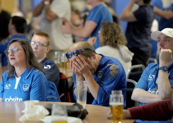 15/5/16

Pompey fans watch the match against Plymouth on big screens at the Victory Bar at Fratton Park. L-R Amanda Wallis,  Steve Johnson, Michael Toomer.

Picture: Paul Jacobs (160254-9) PPP-160515-212926006