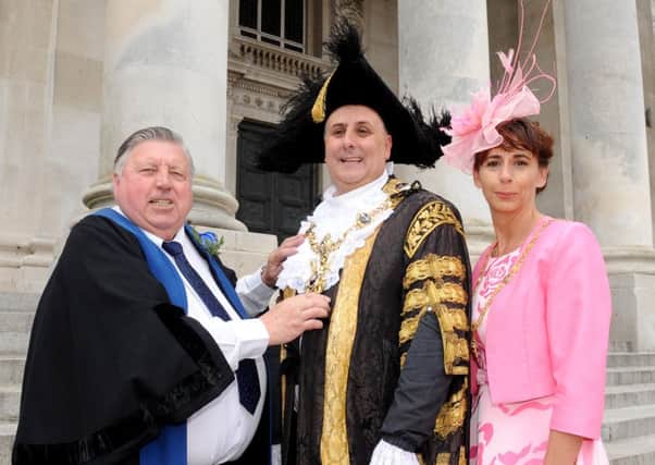 From left, outgoing Lord Mayor of Portsmouth Frank Jonas with newly-elected David Fuller and his sister and Lady Mayoress of Portsmouth Leza Tremorin 

Picture: Sarah Standing (160725-9115)