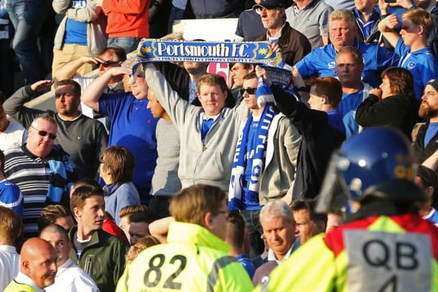 Pompey fans stand proud at the final whistle at Home Park Picture: Joe Pepler