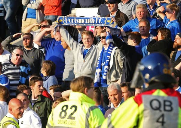 Pompey fans stand proud at the final whistle at Home Park Picture: Joe Pepler