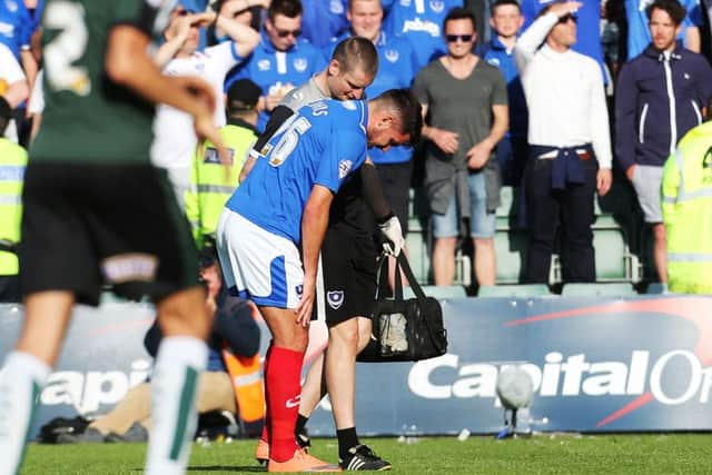 Gareth Evans is forced off with an injury with only half an hour gone at Home Park Picture: Joe Pepler