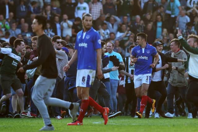 The Plymouth fans celebrate at the final whistle