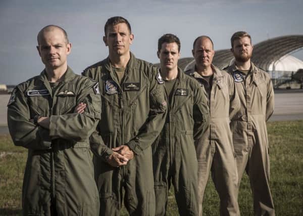 Photo issued by the Ministry of Defence of members of the modern day 617 Squadron as they emulate a picture of the World War II 617 Squadron (left to right) Wing Cdr Jon Butcher, Sqn Leader Hugh Nichol, Lt Rich Pavey, Chief Tech Gary Gibbons, AET Alfred Burrows, as British pilots from the Royal Navy and RAF who will form a new 617 Squadron, are training alongside the US Marine Corps on the F35B Lightning II jet at MCAS Beaufort, South Carolina, USA ahead of the aircraft entering service from 2018. 
Picture: LCpl Jonah Lovy USMC/PA Wire