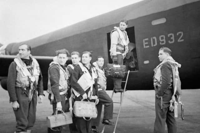 Photo issued by the Imperial War Museum of Wing Commander Gibson and his crew as they board their Avro Lancaster A3-G (ED 932/G) for the Dams' raid,
(left to right) Flight Lieutenant R D Trevor-Roper DEM; Sergeant J Pulford; Flight Sergeant G A Deering RCAF; Pilot Officer F M Spafford DFM RAAF; Flight Lieutenant R E G Hutchinson DFC; Wing Commander Guy Gibson; Pilot Officer H T Taerum RCAF