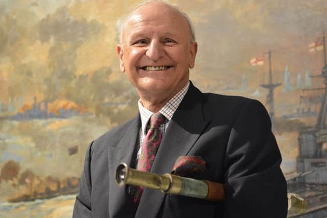 Jock McGrigor holding the telescope which saved life of his father Lieutenant Rhoderick McGrigor during the Battle of Jutland