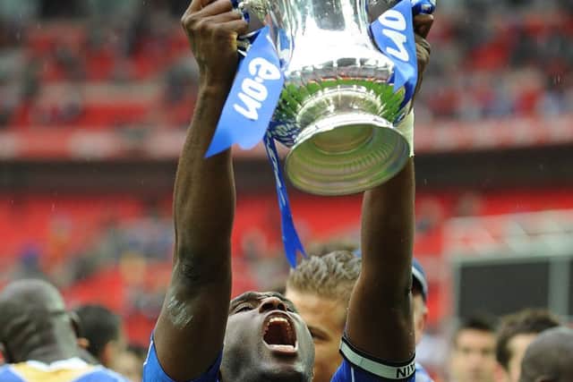 Sol Campbell holds the FA Cup after Pompey's win in 2008 Picture: Tony Marshall