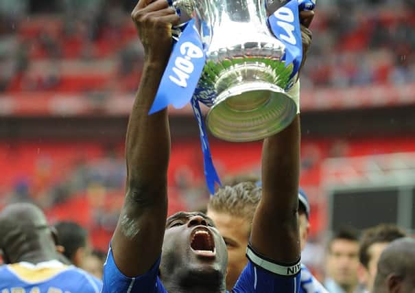 Sol Campbell holds the FA Cup after Pompey's win in 2008  Picture: Tony Marshall