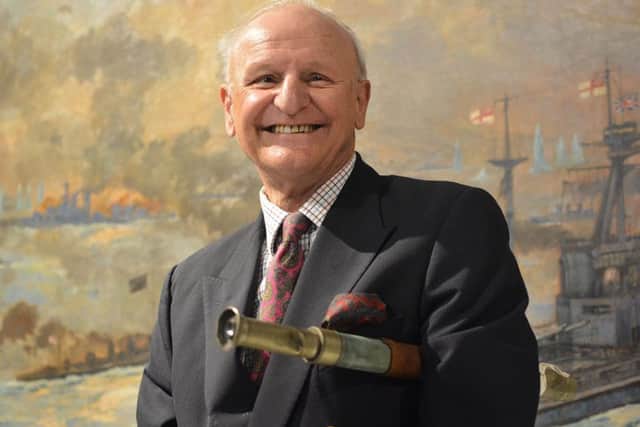 Jock McGrigor holding the telescope which saved life of his father Lieutenant Rhoderick McGrigor during the Battle of Jutland
