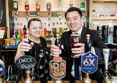 Havant MP Alan Mak toasting the renovation of The Prince of Wales pub in Havant with landlady Ann Redman