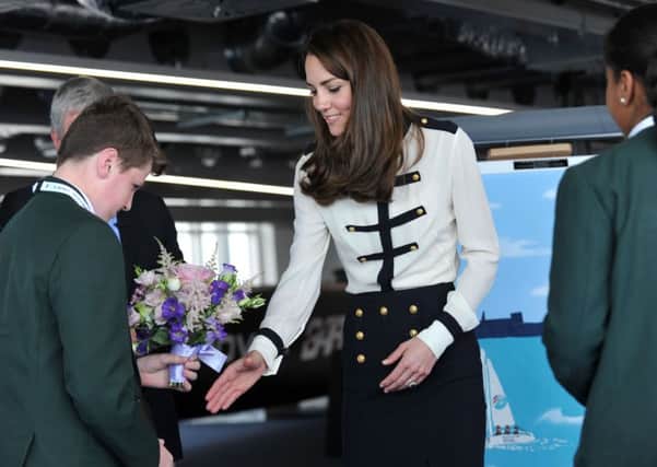 The Duchess of Cambridge is presented with flowers by Oliver Ewins a pupil from St Edmund's Catholic School

Picture: Allan Hutchings (160418-616)