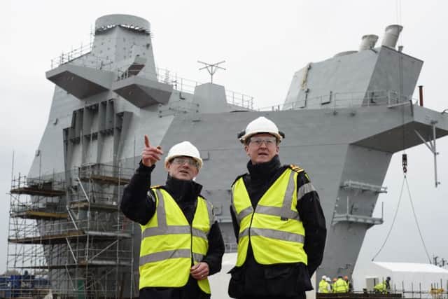 Naval officers on board the flight deck of the nearly-complete Prince of Wales CarrierPictures: John Linton/ACAAlan MacAskill