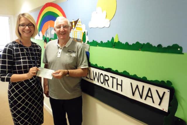 Gosport Rotary member Peter Hitchcock with Haselworth Primary School headteacher Emma Steele