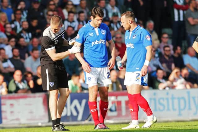 Danny Hollands, centre, had to go off injured in the first half against Plymouth. Picture: Joe Pepler