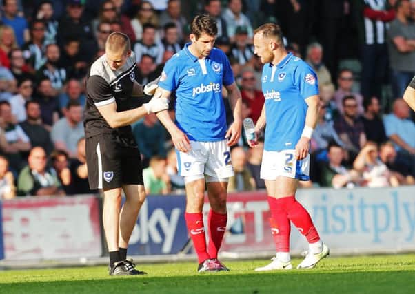 Danny Hollands, centre, had to go off injured in the first half against Plymouth. Picture: Joe Pepler