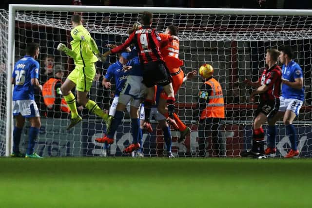 Morecambe keeper Barry Roche heads home a 94th-minute equaliser against Pompey  Picture: Joe Pepler