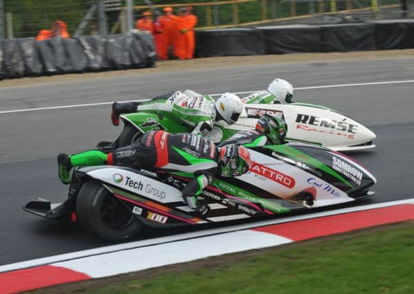 Ricky Stevens and Ryan Charlwood, front, bid to overtake British Formula One sidecar championship title rivals Tim Reeves and Greg Cluze at Brands Hatch                           Picture: John Mushet