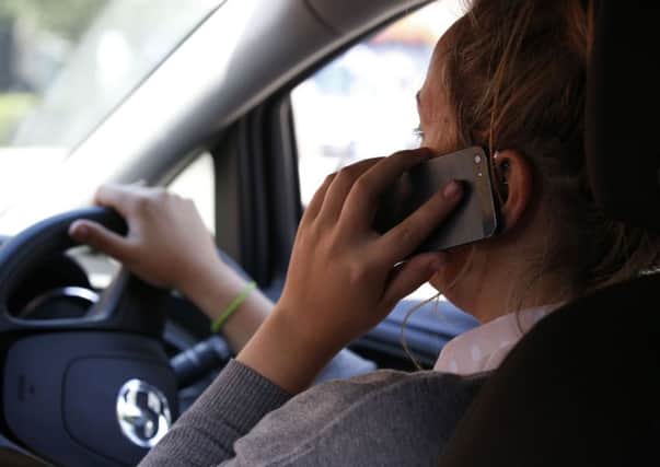 Police have launched a campaign against people using phones at the wheel