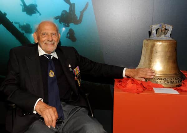 Veteran Lloyd Adams with HMS Hood's bell
Picture: Sarah Standing (160737-228)