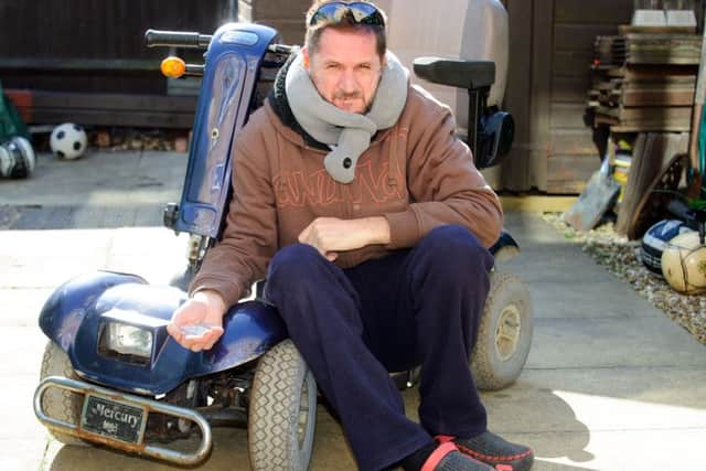 Nick Rundle with his old mobility scooter after it was attacked and broken by an 11-year-old boy.
Picture: Allan Hutchings (160407-942)