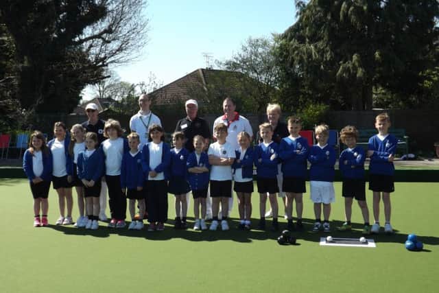 Trevor Kelly (coach), Simon Everest (Teacher), Bryan Franklin (coach), Robert Paxton (England International) and Pam Lambshead (coach) with the school pupils