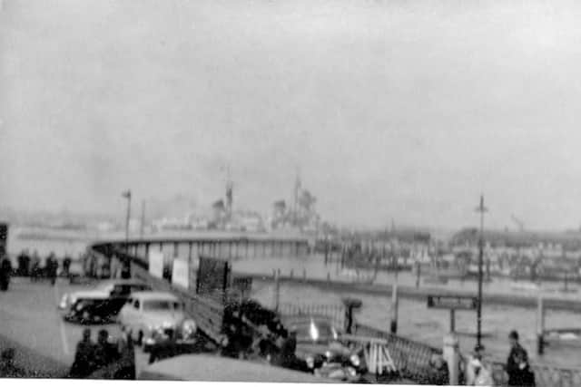 jpwm-28-05-16-010 rwARRIVAL OF RUSSIAN CRUISER 1956The Russian Sverdlov class  cruiser Ordzhonikidze arrives at South Railway Jetty in 1956. Note the entrance gates to the railway viaduct in the foreground.