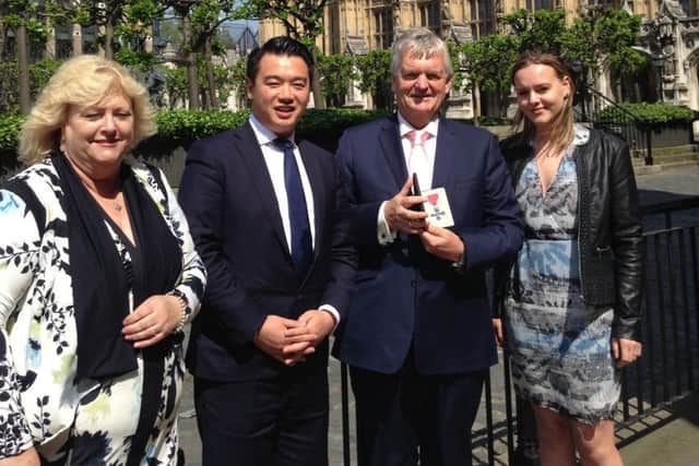 HERO Peter McQuade and his family join Alan Mak in London