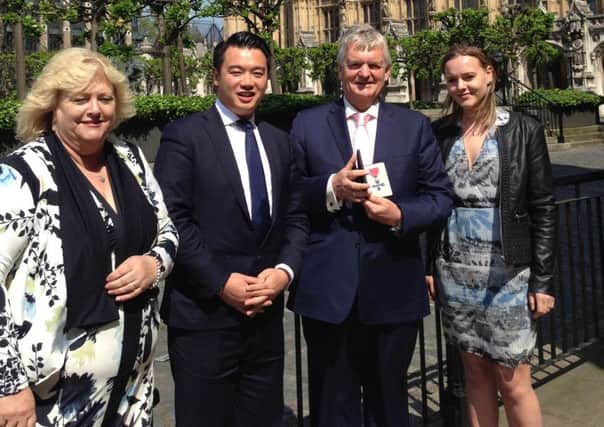 HERO Peter McQuade and his family join Alan Mak in London